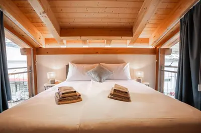 Ein Bett oder Betten in einem Zimmer der Unterkunft Turuwang Penthouse by HomeFlow