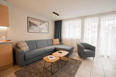 Ein Sitzbereich in der Unterkunft Turuwang Apartment by HomeFlow