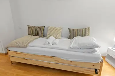 Ein Bett oder Betten in einem Zimmer der Unterkunft Crans-Montana - Studio centre 2 pers - Rue du Prado