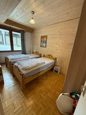 Ein Bett oder Betten in einem Zimmer der Unterkunft Charmant appartement - Crans-Montana