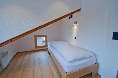 Ein Bett oder Betten in einem Zimmer der Unterkunft Aletschhorn, Chalet Wiedersehen