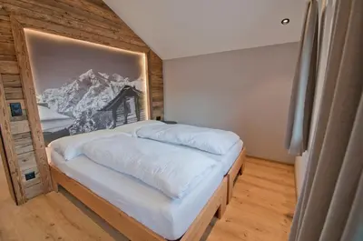Ein Bett oder Betten in einem Zimmer der Unterkunft Aletschhorn, Chalet Wiedersehen