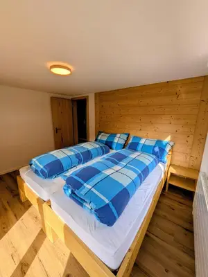 Ein Bett oder Betten in einem Zimmer der Unterkunft Ferienwohnung Rosenburg