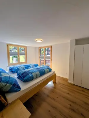 Ein Bett oder Betten in einem Zimmer der Unterkunft Ferienwohnung Rosenburg