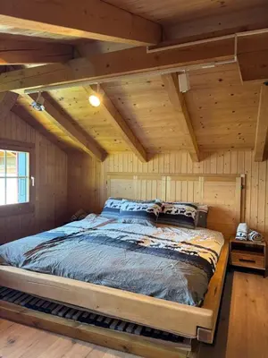 Ein Bett oder Betten in einem Zimmer der Unterkunft Chalet Zytrösli