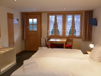 Ein Bett oder Betten in einem Zimmer der Unterkunft Apartment Chalet Schwendihus-4 by Interhome