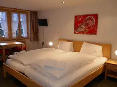 Ein Bett oder Betten in einem Zimmer der Unterkunft Apartment Chalet Schwendihus-4 by Interhome