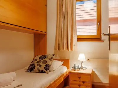 Ein Bett oder Betten in einem Zimmer der Unterkunft Apartment Hortensia 33 by Interhome