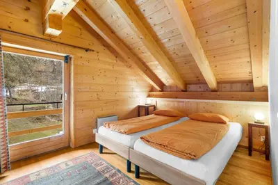 Ein Bett oder Betten in einem Zimmer der Unterkunft Chalet La Verne - appartement du Haut - 9 pers -