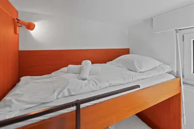 Ein Bett oder Betten in einem Zimmer der Unterkunft Crans-Montana, 5 pers, balcon vue et parking privé
