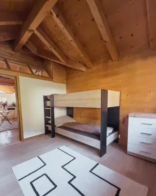 Ein Bett oder Betten in einem Zimmer der Unterkunft Grosszügige Wohnung Leiterli