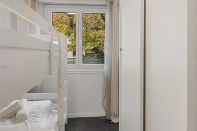 Ein Bett oder Betten in einem Zimmer der Unterkunft Crans-Montana 6 pers, grand appart rénové avec balcon, vue & parking