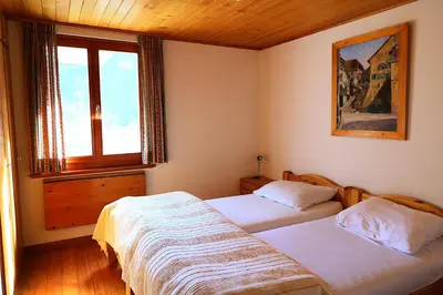 Ein Bett oder Betten in einem Zimmer der Unterkunft Chalet Kiri 8 personnes Sur les hauteurs d Evolene