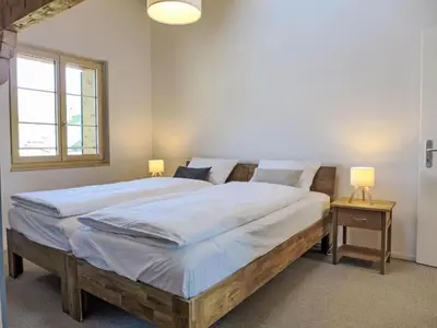 Ein Bett oder Betten in einem Zimmer der Unterkunft Apartment Bärgli in Krattigen