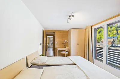 Ein Bett oder Betten in einem Zimmer der Unterkunft Family-friendly apartment with mountain views