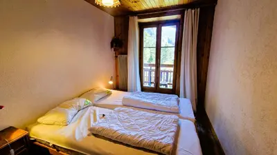 Ein Bett oder Betten in einem Zimmer der Unterkunft Residence Evolene 31 Appartement 2 personnes