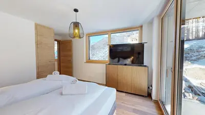 Ein Bett oder Betten in einem Zimmer der Unterkunft Alphubel PEAK