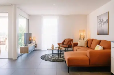 Ein Sitzbereich in der Unterkunft Apartment Eiger in See- und Bergnähe, modern, mit Balkon und Aussicht für 4 Gäste