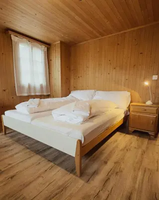 Ein Bett oder Betten in einem Zimmer der Unterkunft Chalet Brauerei