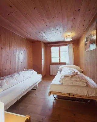Ein Bett oder Betten in einem Zimmer der Unterkunft Chalet Brauerei
