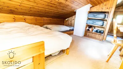 Ein Bett oder Betten in einem Zimmer der Unterkunft Chalet Dorle, Riederalp Golmenegg