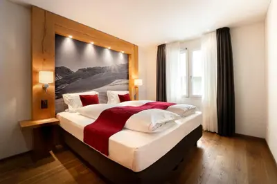 Ein Bett oder Betten in einem Zimmer der Unterkunft Apartment Crown Andermatt-2