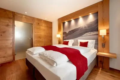 Ein Bett oder Betten in einem Zimmer der Unterkunft Apartment Crown Andermatt-2