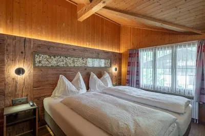 Ein Bett oder Betten in einem Zimmer der Unterkunft Chalet Stöckli