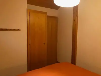 Ein Bett oder Betten in einem Zimmer der Unterkunft En Anniviers, chalet cosy au centre du village de Saint Jean
