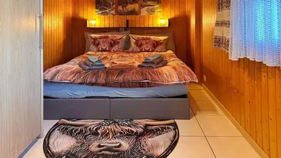 Ein Bett oder Betten in einem Zimmer der Unterkunft Gemütliche 2-Zimmer Wohnung mir Bergblick