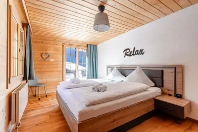Ein Bett oder Betten in einem Zimmer der Unterkunft Apartment Chalet Condor - Aare Jungfrau AG