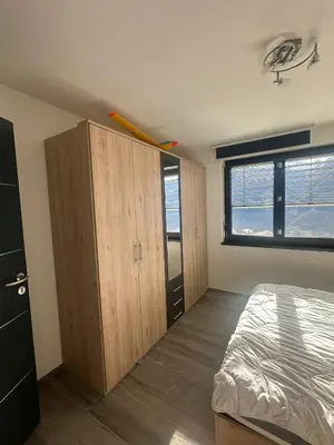 Ein Bett oder Betten in einem Zimmer der Unterkunft Chambres dans villa à 10 minutes de Crans-Montana