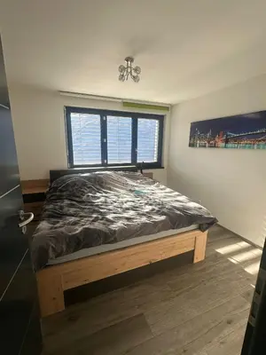 Ein Bett oder Betten in einem Zimmer der Unterkunft Chambres dans villa à 10 minutes de Crans-Montana