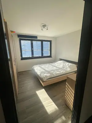 Ein Bett oder Betten in einem Zimmer der Unterkunft Chambres dans villa à 10 minutes de Crans-Montana