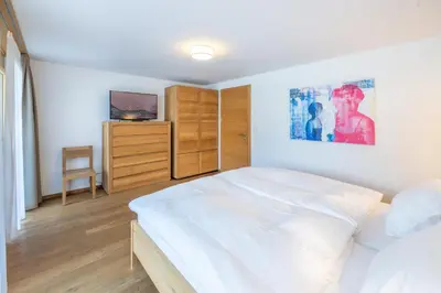 Ein Bett oder Betten in einem Zimmer der Unterkunft Center peak apartment Zermatt
