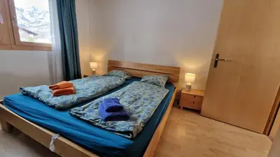 Ein Bett oder Betten in einem Zimmer der Unterkunft Snowfun A