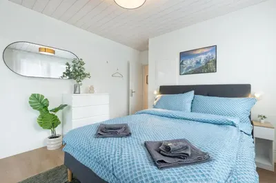 Ein Bett oder Betten in einem Zimmer der Unterkunft Mountain view with balcony and free parking