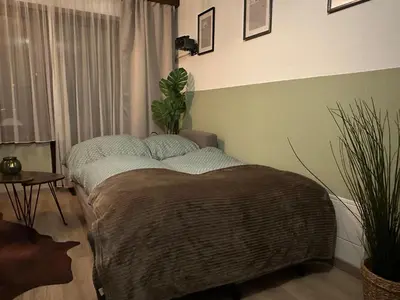 Ein Bett oder Betten in einem Zimmer der Unterkunft Haus Silence - Berge & Sonne im Saastal Ski Wandern Familie Haustiere