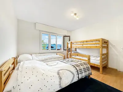 Ein Bett oder Betten in einem Zimmer der Unterkunft Alpine Vista - Next to the Cable car - Swiss Alps