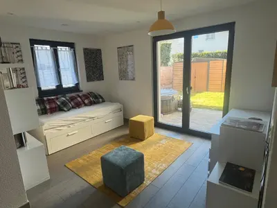 Ein Sitzbereich in der Unterkunft Suite moderne avec jacuzzi
