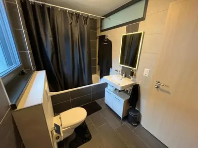 Ein Badezimmer in der Unterkunft Suite moderne avec jacuzzi