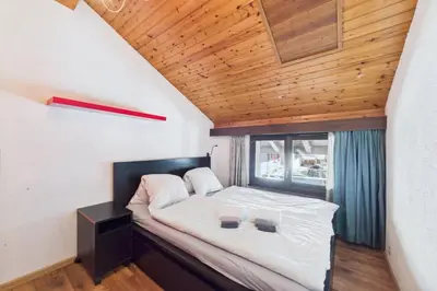 Ein Bett oder Betten in einem Zimmer der Unterkunft Central Apartment for 6 the Heart of Saas-Fee