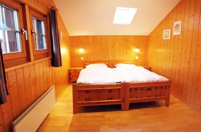 Ein Bett oder Betten in einem Zimmer der Unterkunft Chalet Heimeli