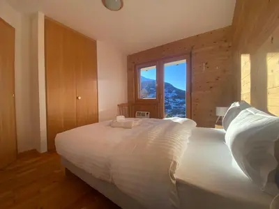 Ein Bett oder Betten in einem Zimmer der Unterkunft Chalet Les Brantes, refuge atypique a Veysonnaz