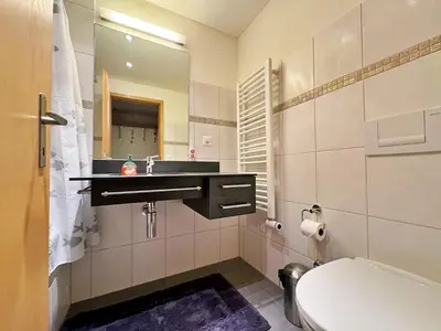 Ein Badezimmer in der Unterkunft Eiger Residence 3