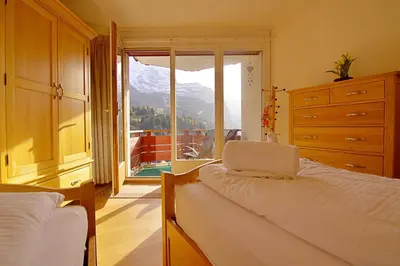 Ein Bett oder Betten in einem Zimmer der Unterkunft Eiger Residence 3