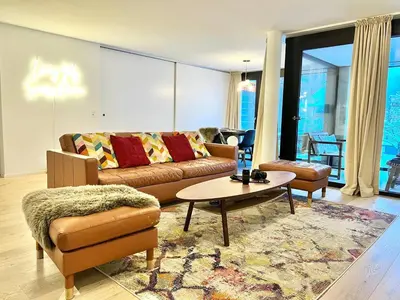 Ein Sitzbereich in der Unterkunft Modern Apartment with Balcony and BBQ at Interlaken West Station