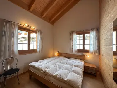 Ein Bett oder Betten in einem Zimmer der Unterkunft Chalet Allegra AL0