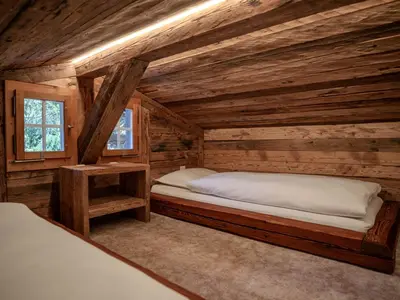 Ein Bett oder Betten in einem Zimmer der Unterkunft Chalet with fireplace and sauna