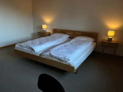 Ein Bett oder Betten in einem Zimmer der Unterkunft Apartment Büel in Krattigen